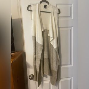 Long sleeveless sweater vest.